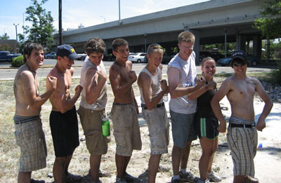 Saline Fiddlers guys demonstrate their toughness, as Kelsey gives a thumbs-up.